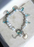 Handgemachter Perlenarmband mit türkisen Glasperlen und Muschelcharms, einzigartiger Schmuck